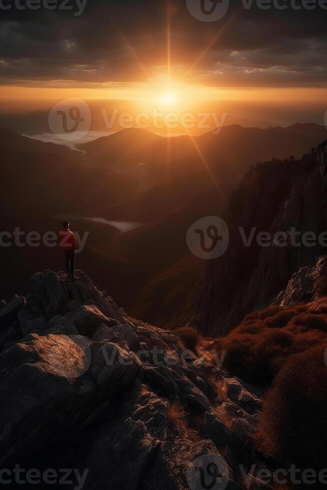 a man is standing on a mountain. photo