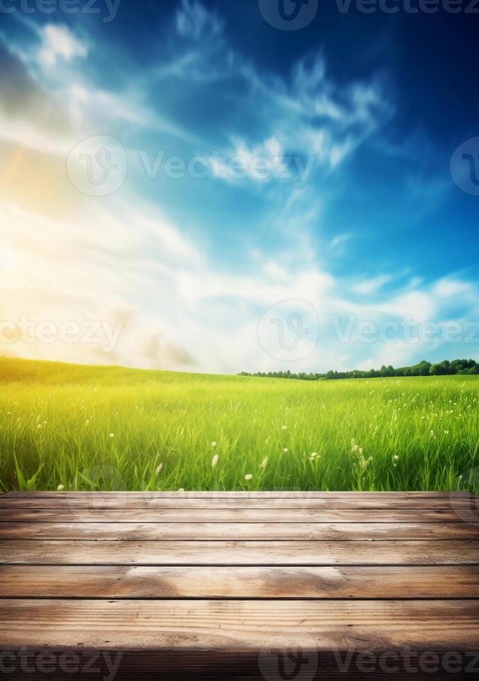 Spring summer beautiful background with green juicy young grass and empty wooden table in nature outdoor. Natural template landscape with blue sky and sun. photo