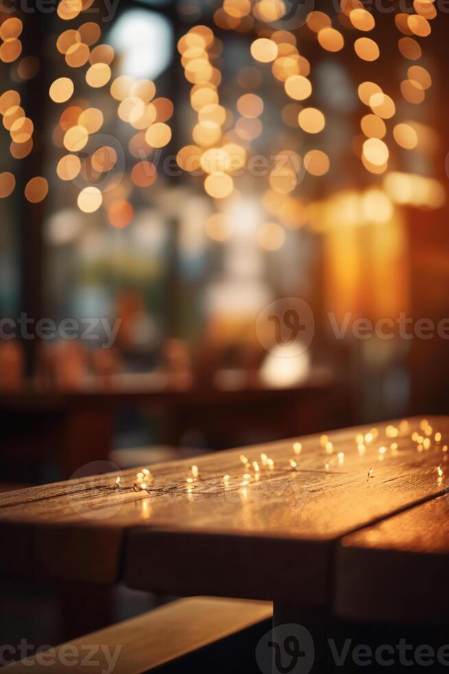 Image of wooden table in front of abstract blurred background of restaurant lights. photo