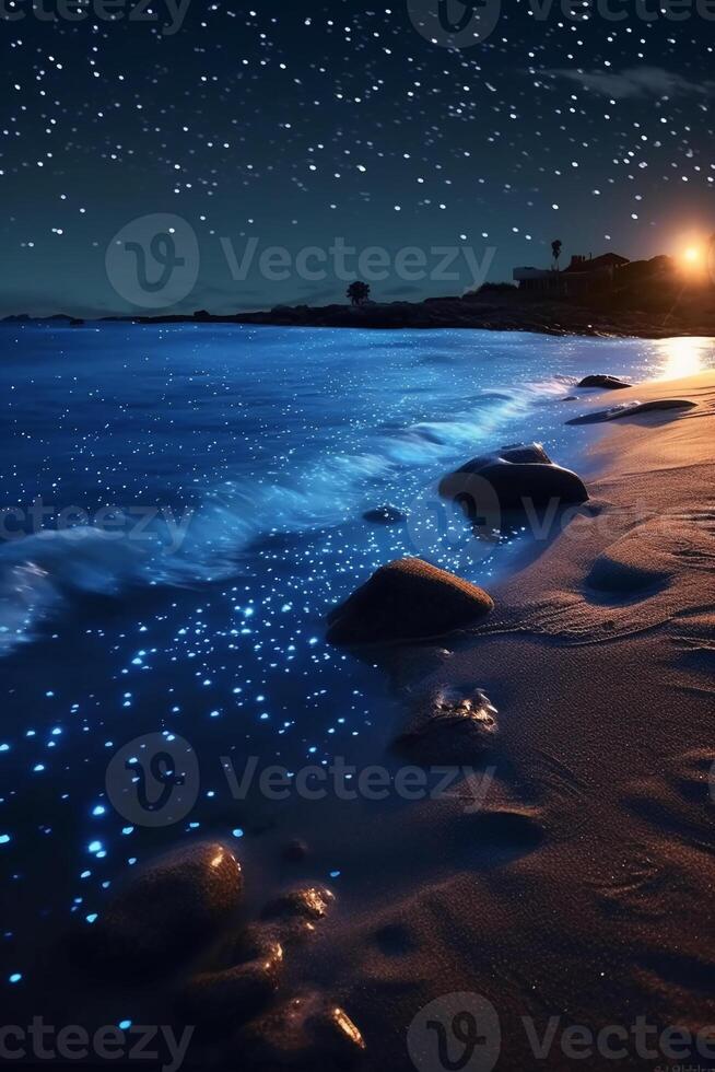 Ocean shore at night, the water is full of dinoflagellates, glowing with millions bright blue neon glow in the dark tiny dots. photo