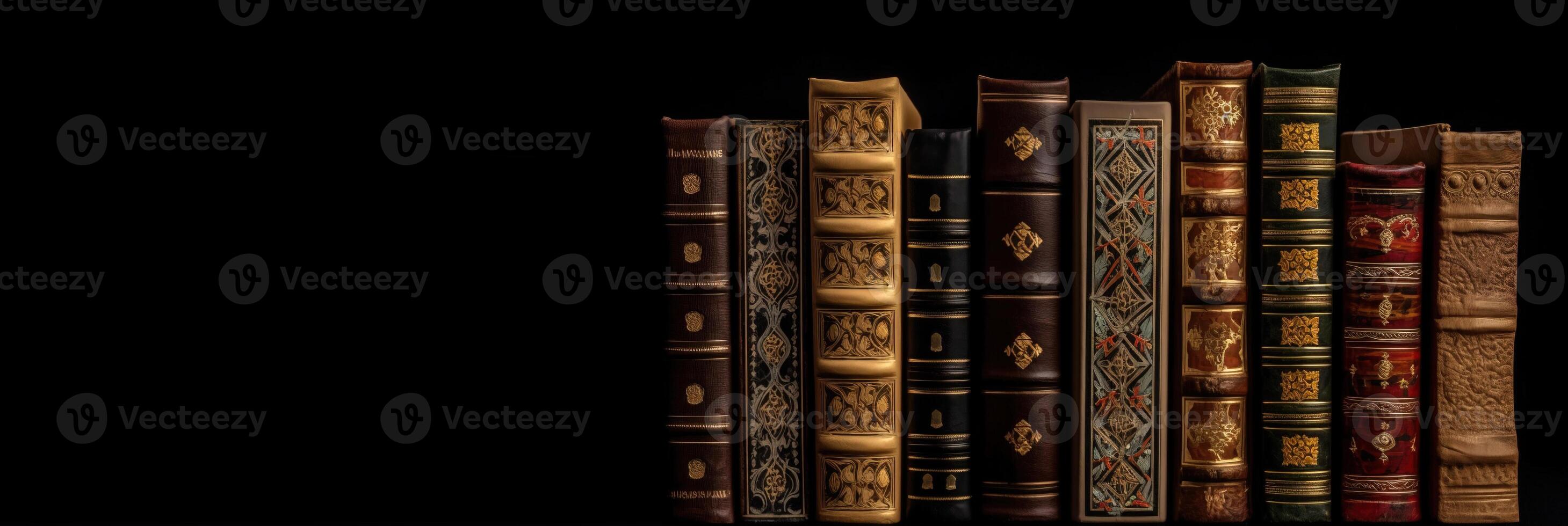 Number of old ancient books, library of knowledge textbooks. Black background isolate. . photo