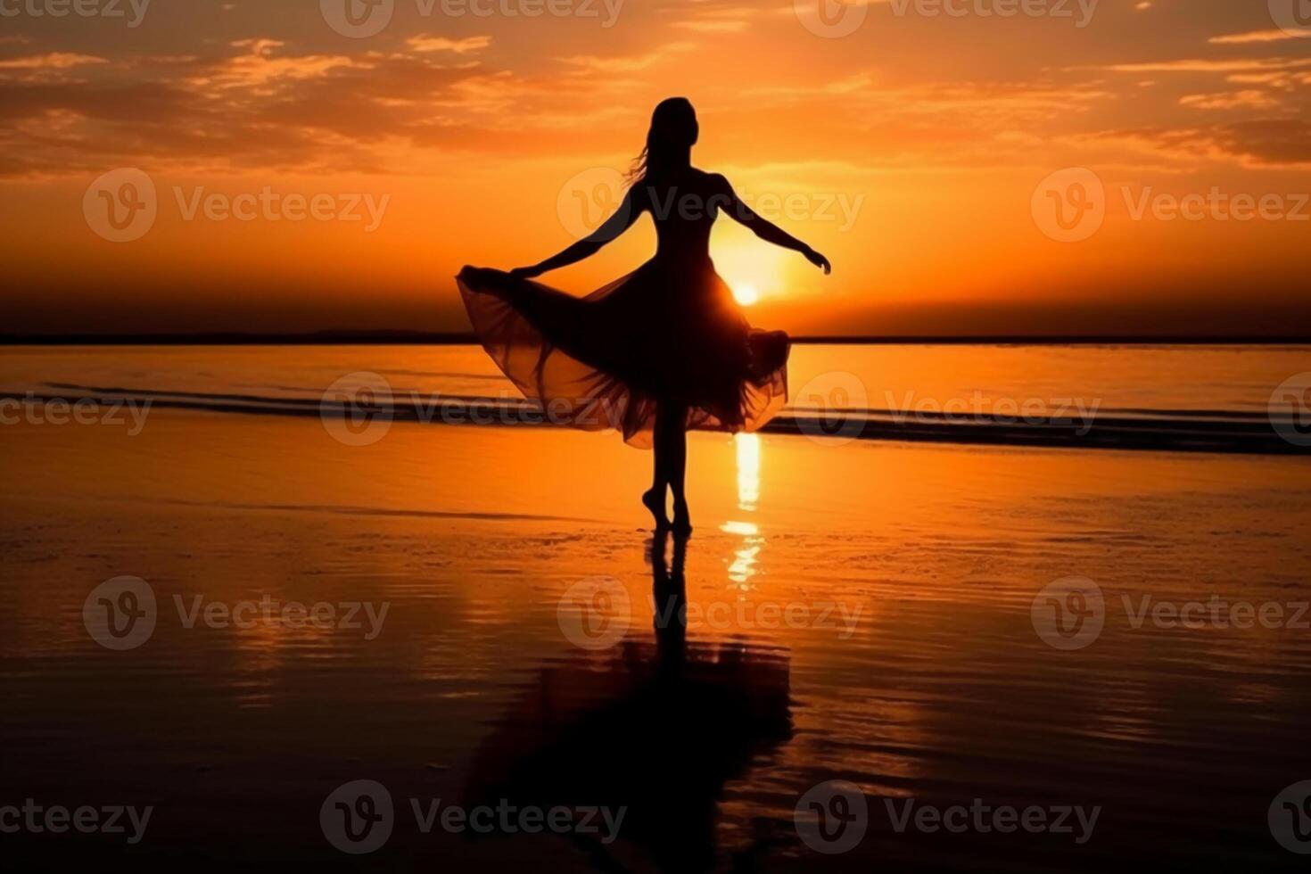 the silhouette of a ballerina on the sunset beach. photo
