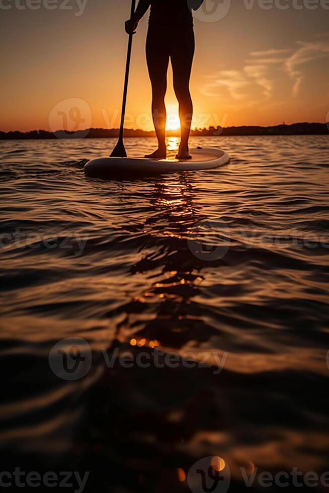 Stand up paddle boarding on quiet sea. photo