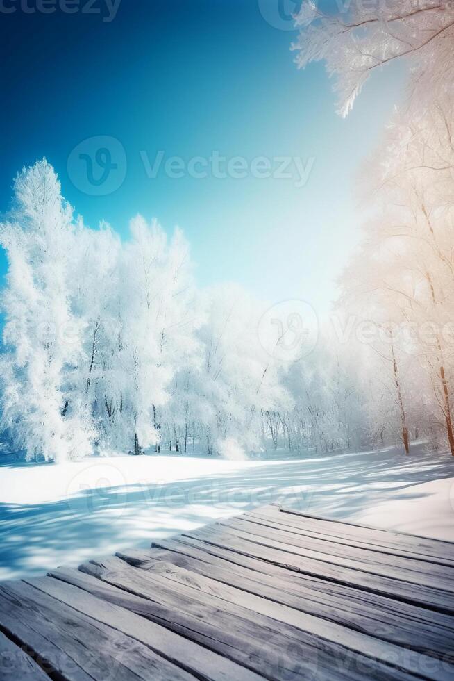 Winter Christmas scenic landscape with copy space. Wooden flooring, white trees in forest covered with snow, snowdrifts and snowfall against blue sky in sunny day photo