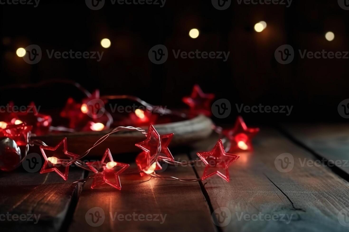 Christmas background with blue light luminous garlands and red stars on a white wooden background with copy space. photo