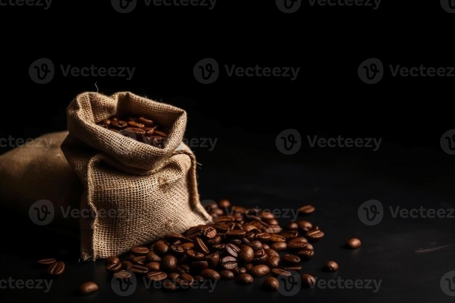Top view of coffee beans in a sack on dark background. photo