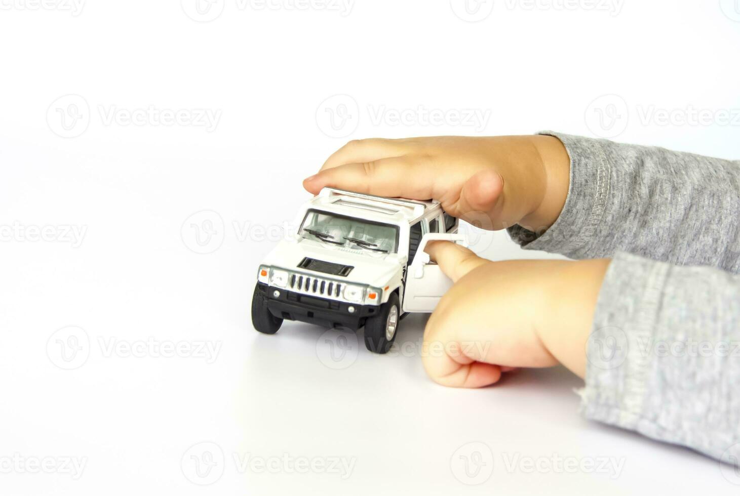 A child plays with a typewriter. Close-up of a child's hand. photo