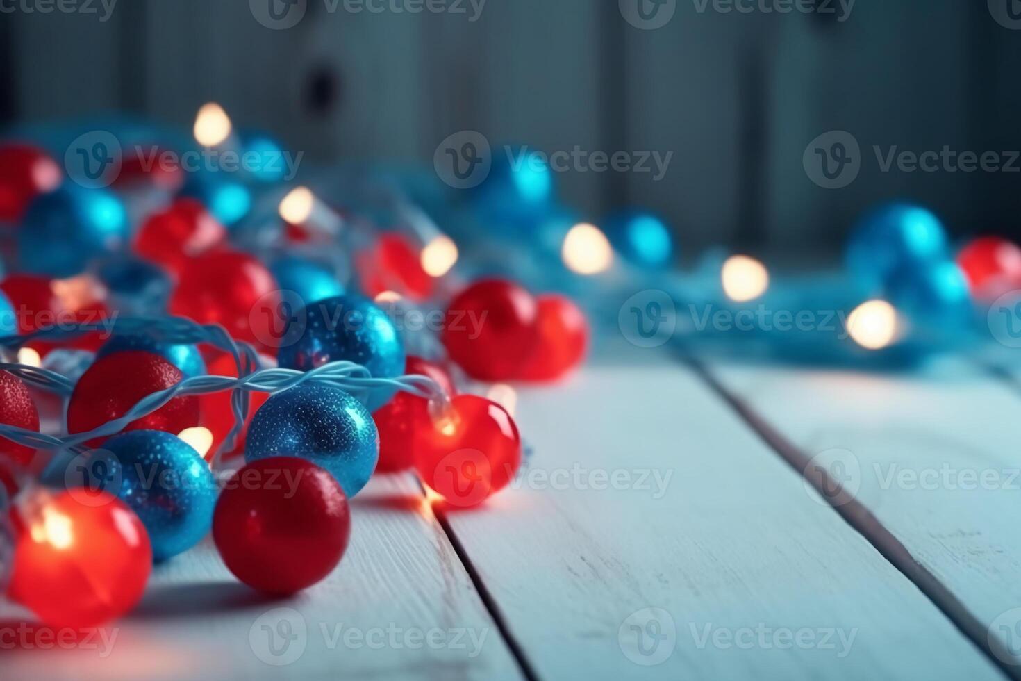 Christmas background with blue light luminous garlands and red stars on a white wooden background with copy space. photo