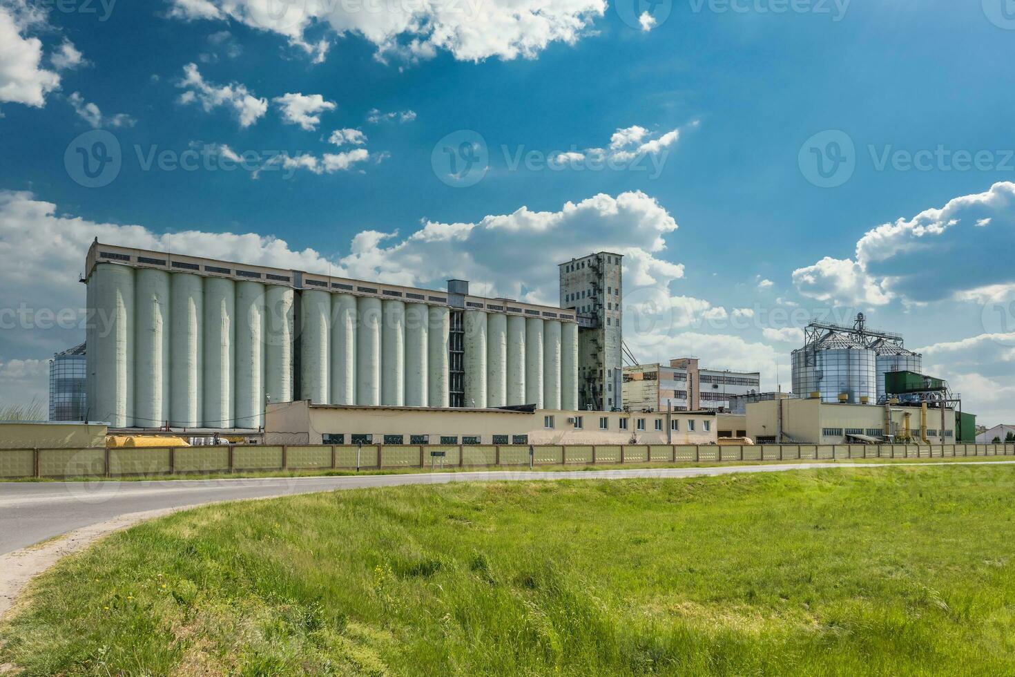 agro silos granary elevator with seeds cleaning line on agro-processing manufacturing plant for processing drying cleaning and storage of agricultural products photo