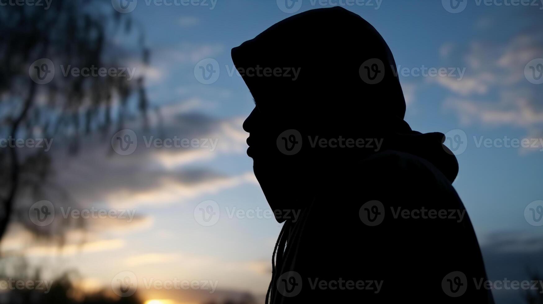 Side view, Silhouette of the face, a person, low angle, blurred fresh dawn sky. photo