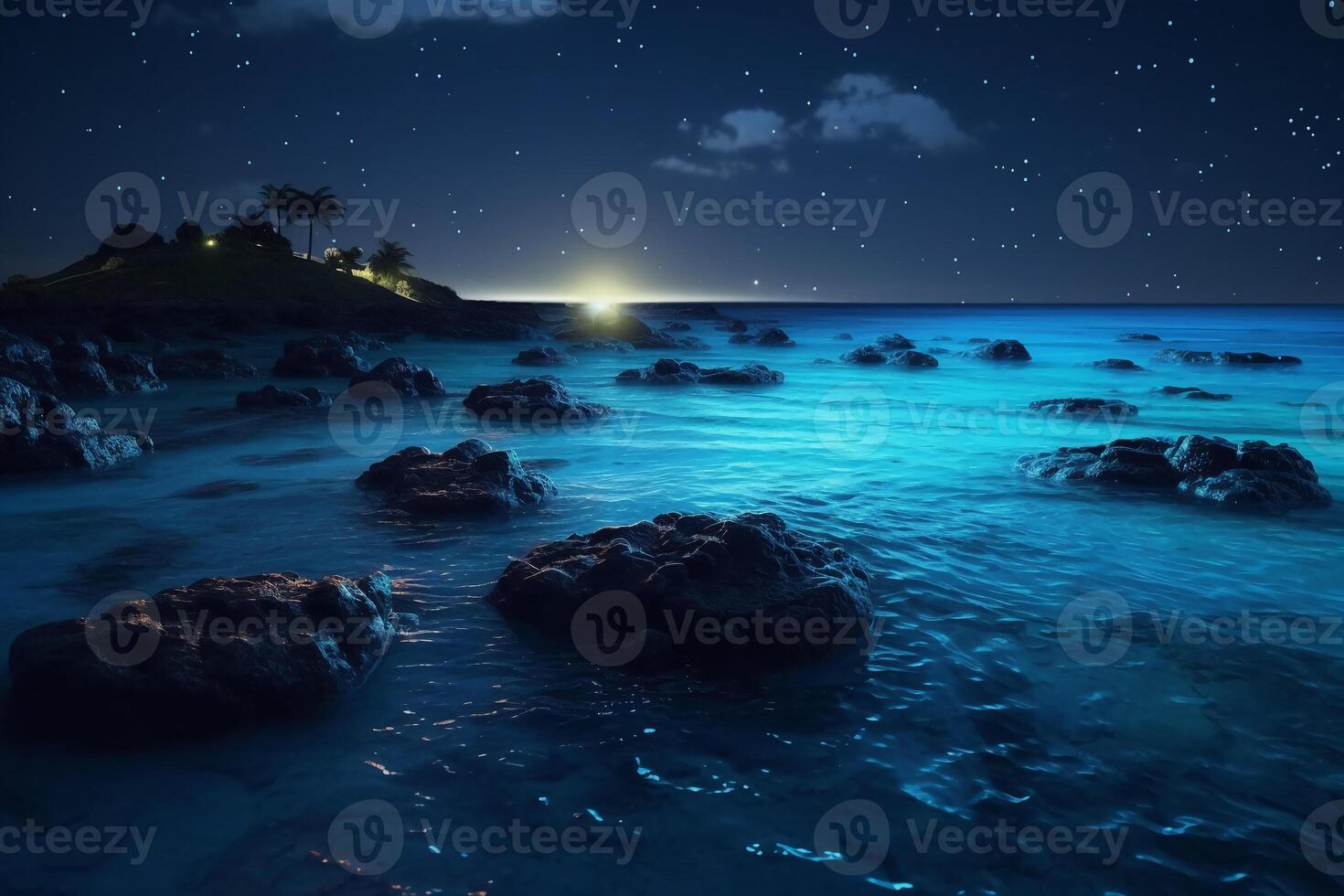 Ocean shore at night, the water is full of dinoflagellates, glowing with millions bright blue neon glow in the dark tiny dots. photo