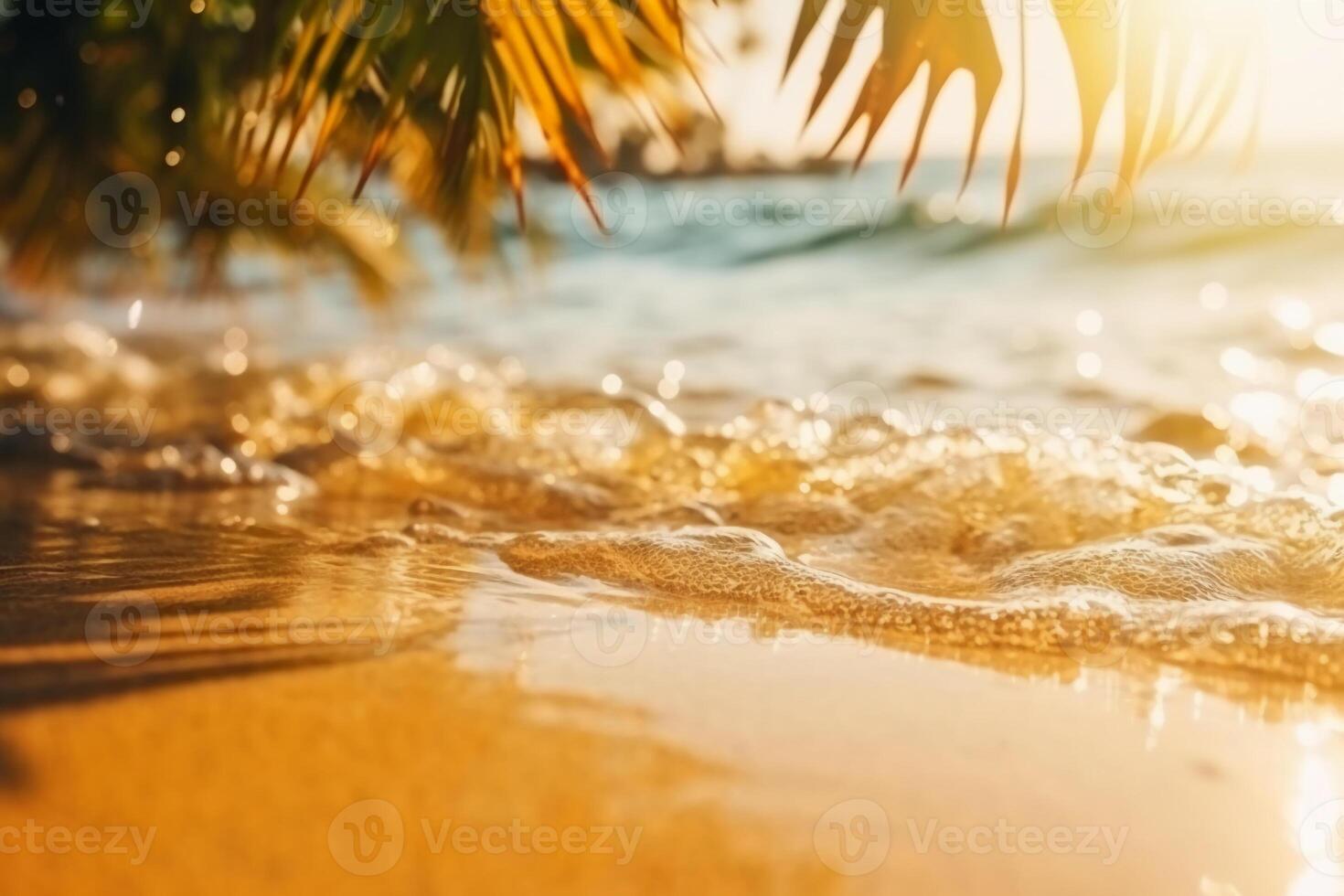 Beautiful background for summer vacation and travel. Golden sand of tropical beach, blurry palm leaves and bokeh highlights on water on sunny day. photo