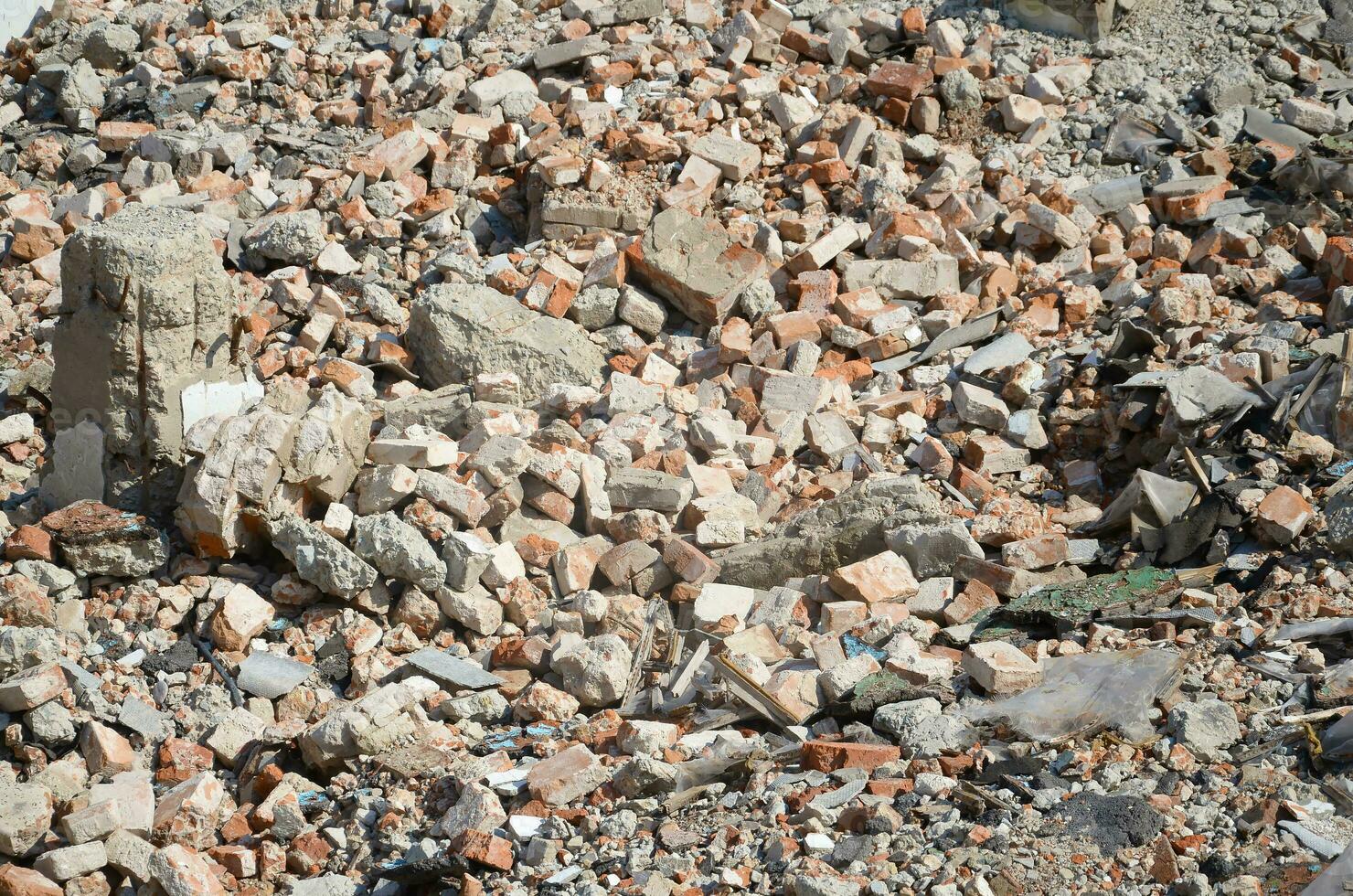 Pile of bricks and fragments of concrete from destroyed building photo