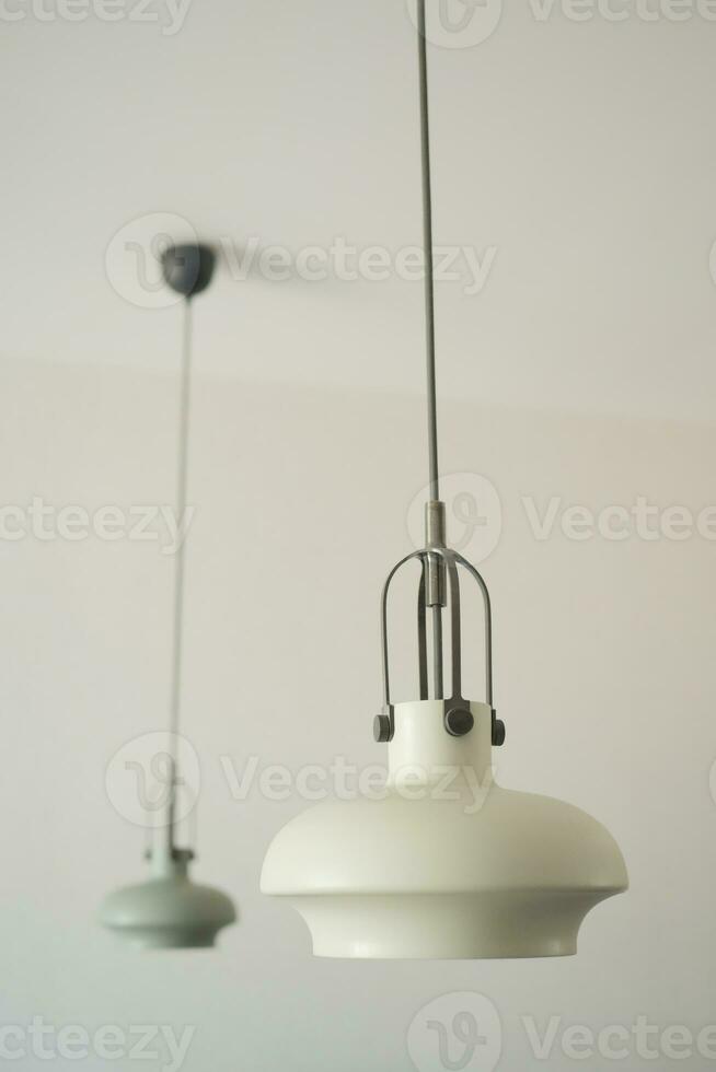 gray ceiling lamp hanging in a room , photo