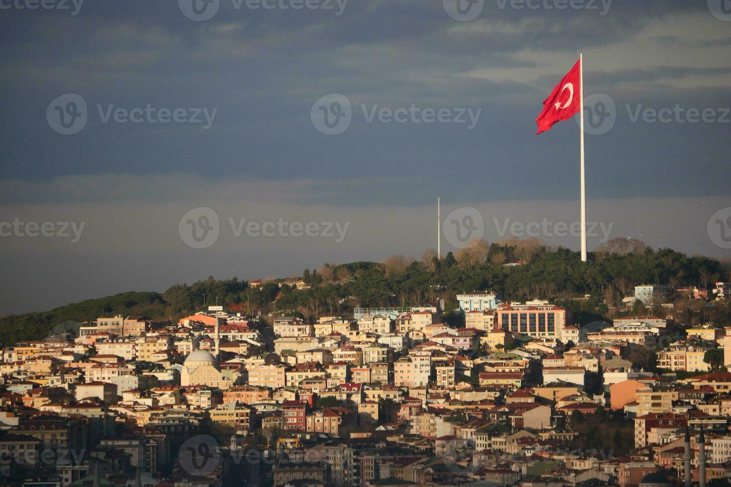 Cityscape of istanbul with turkish flag photo