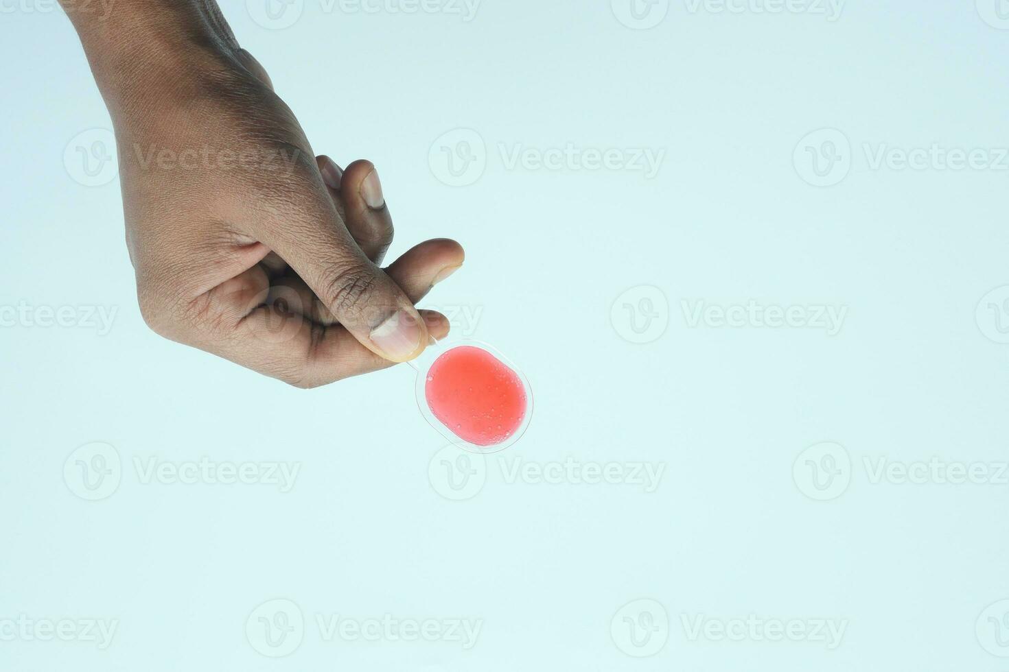 top view of liquid medicine on plastic spoon photo