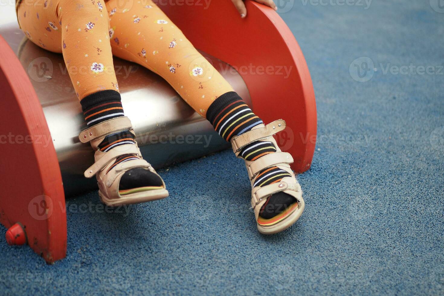 Child cerebral palsy disability with legs orthosis shoe photo