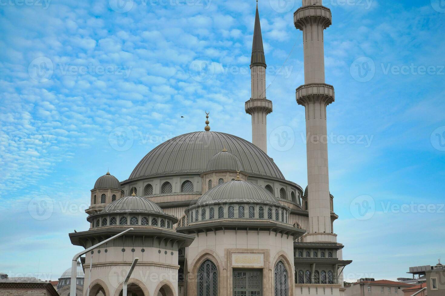 a beautiful mosque against blue sky photo