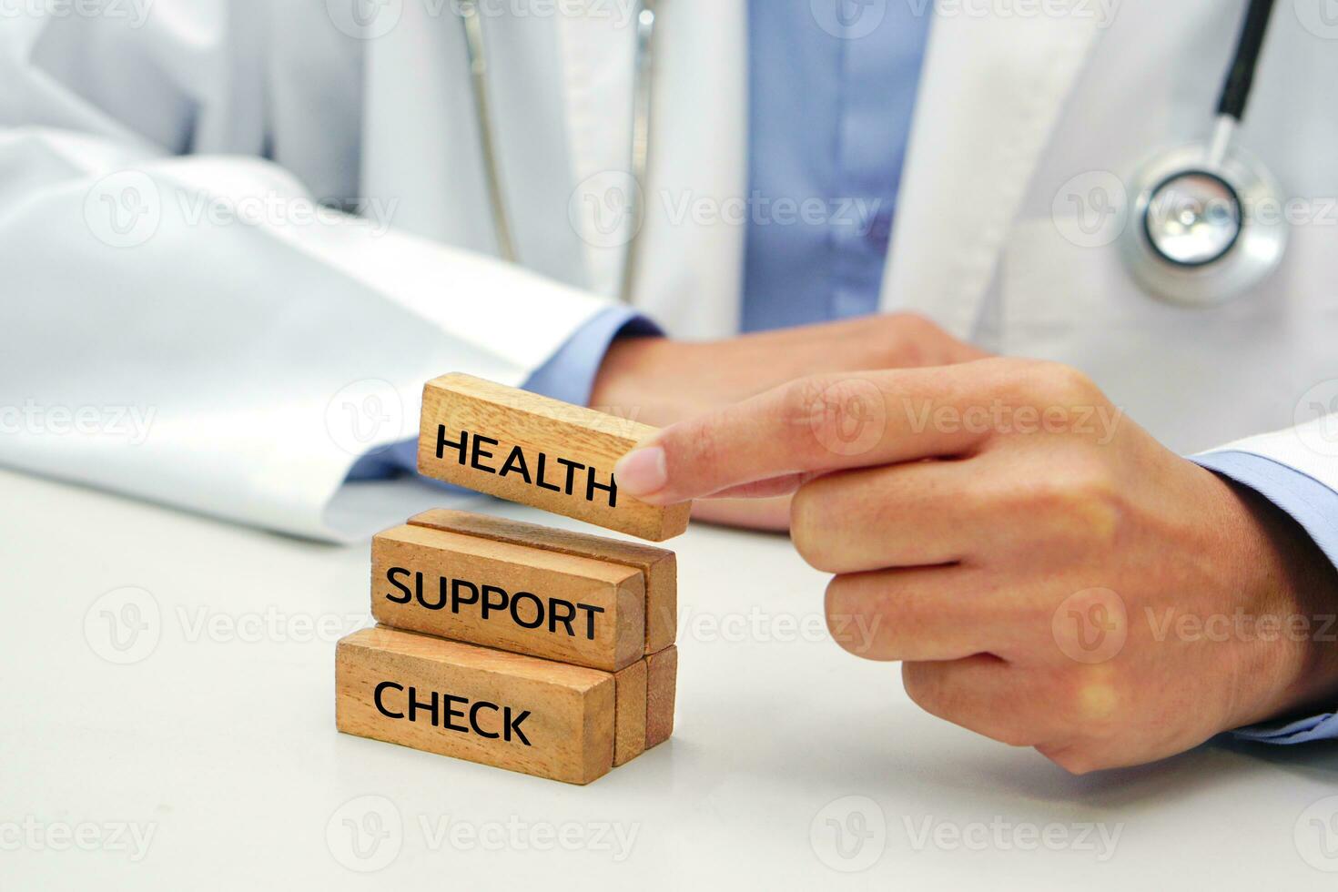 Hand holding a wooden block cube the top one with word and icon symbol. Medical and health concept. photo