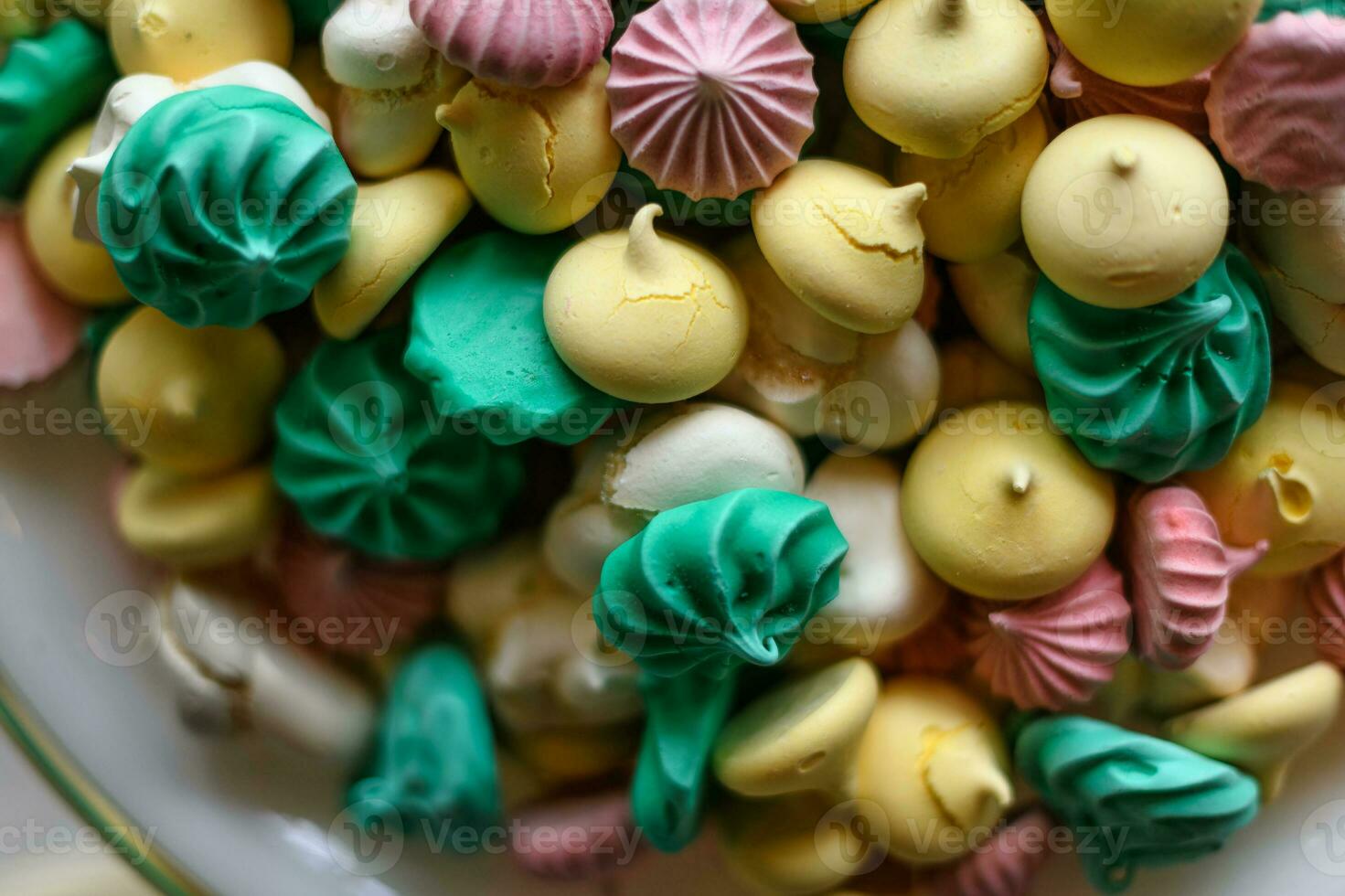 Mixed coloured meringues in a buffet photo