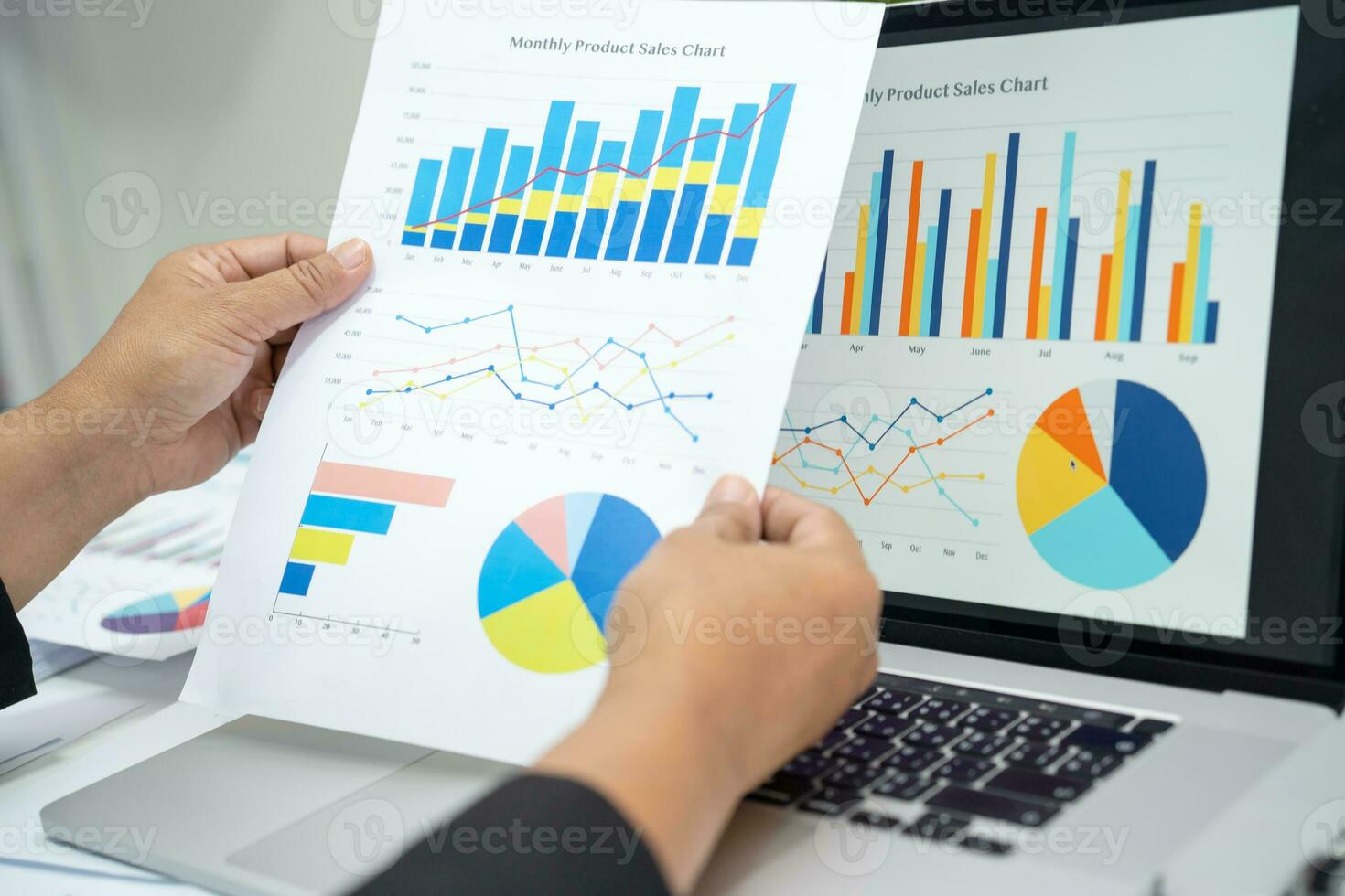 Asian accountant working and analyzing financial reports project accounting with chart graph in modern office, finance and business concept. photo
