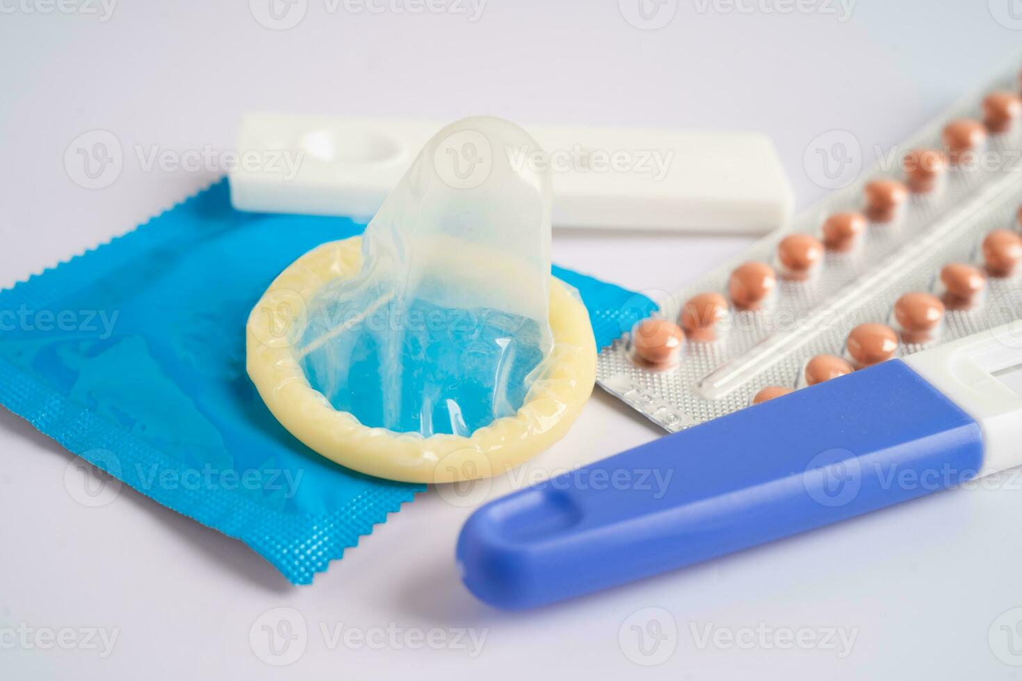 Birth control pills and condom, contraception health and medicine. photo