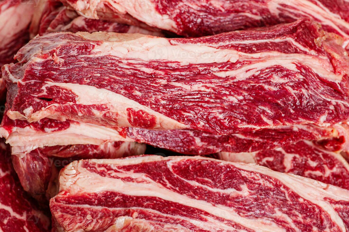 Marbled beef steaks as a background close-up. Fresh meat. Cooking. photo