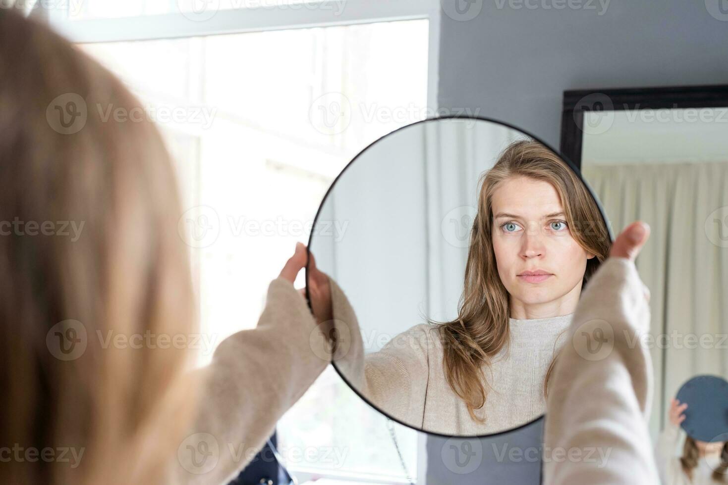Woman sitting at bed at home drinking coffee photo