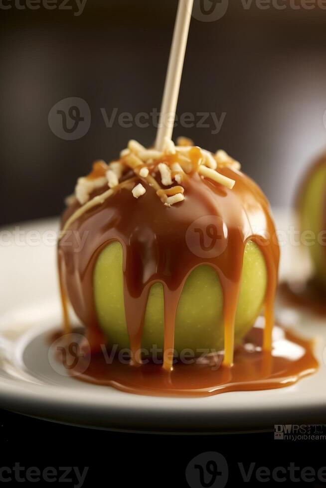 Delicious caramel apple wooden stick on plate. photo