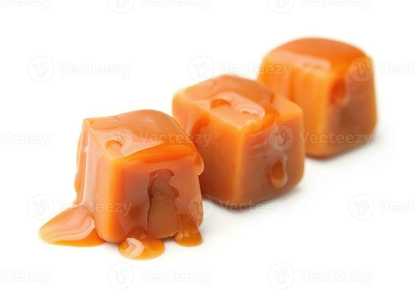 Caramel candies and caramel topping. photo