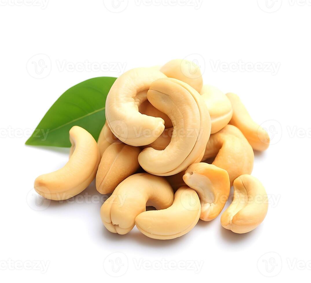 Cashew nuts with leaves closeup on a white background. . photo