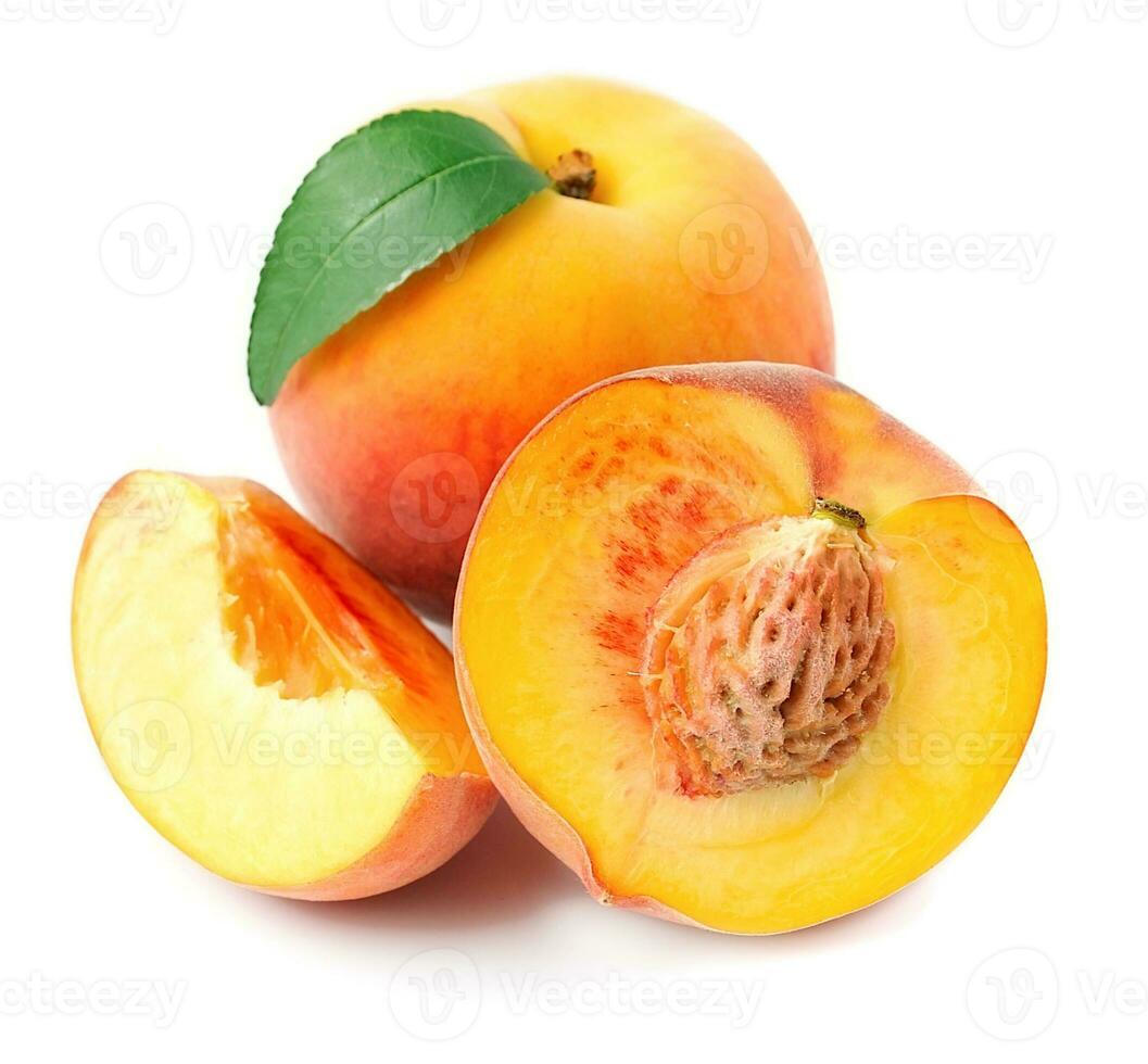 Ripe peach with leaves . photo