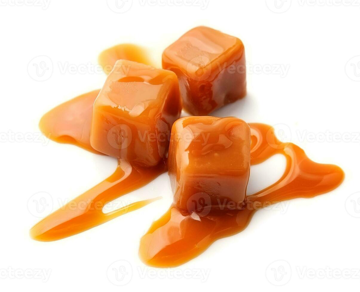Caramel candies and caramel topping . photo