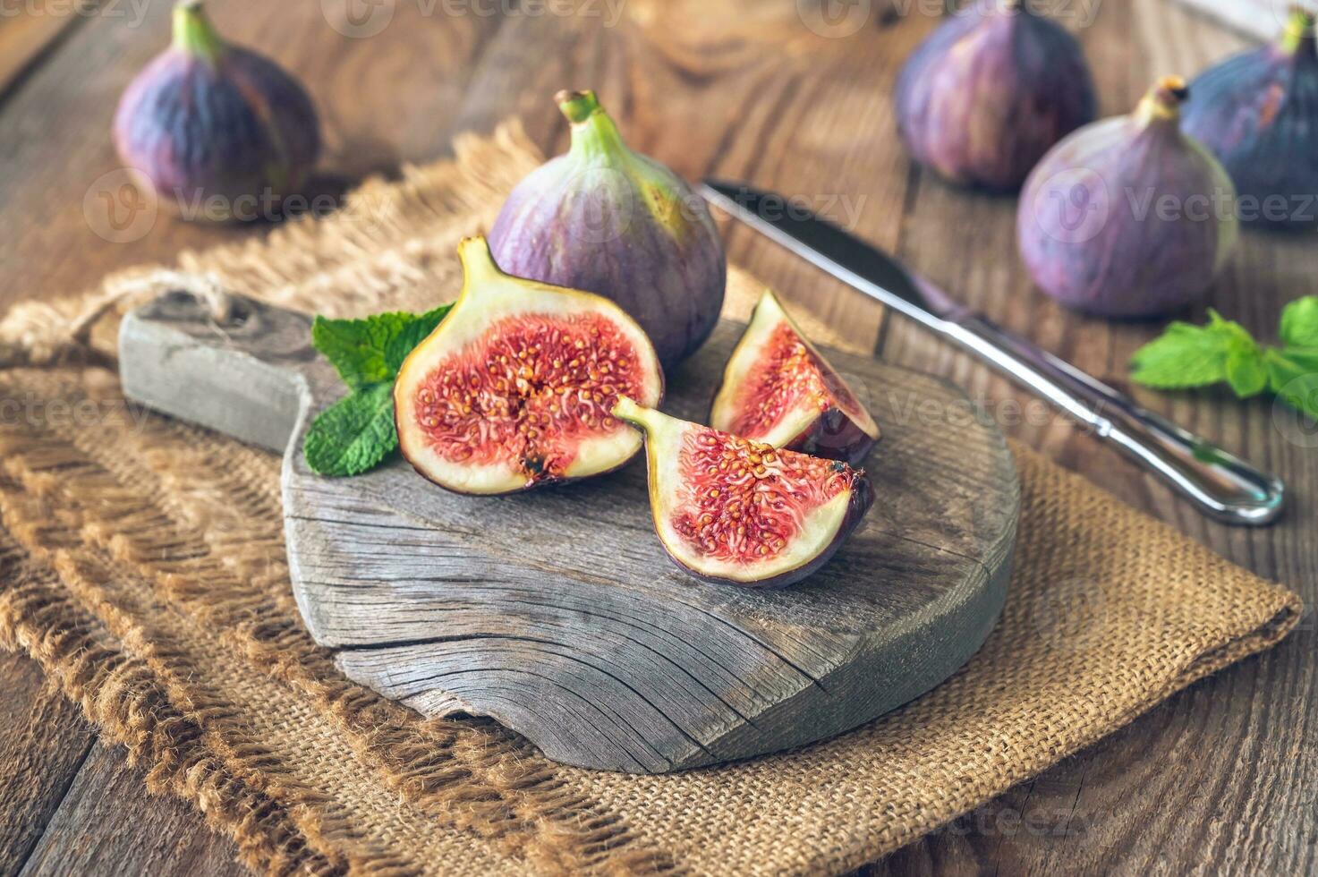 Fresh figs on the wooden board photo