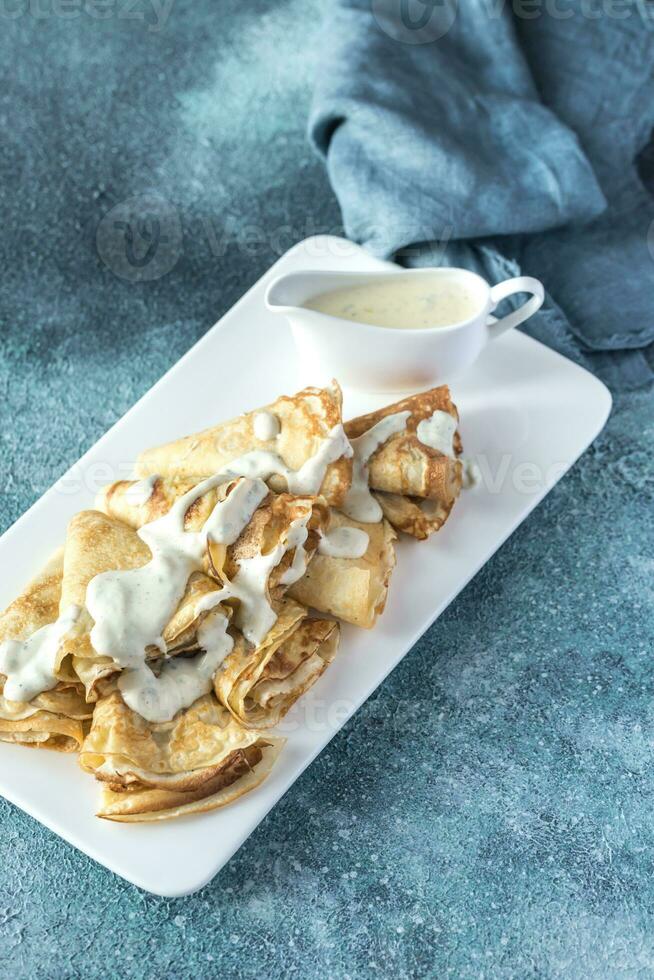 Crepes with blue cheese sauce photo