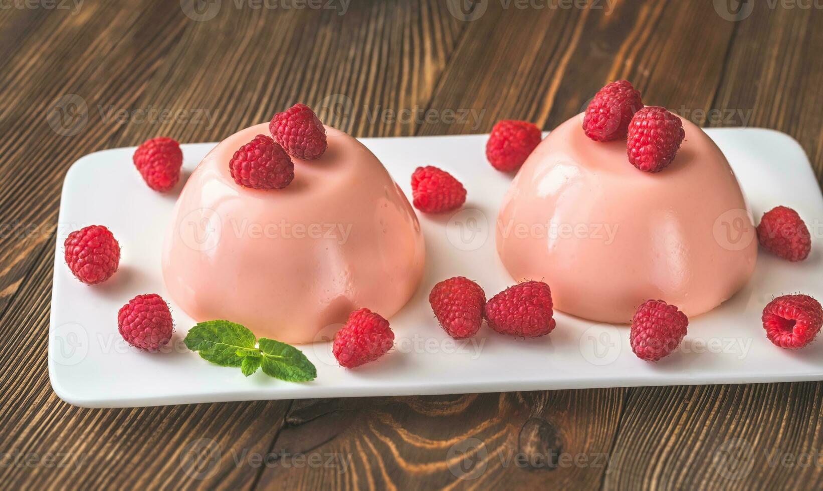 Dessert puddings with raspberries photo
