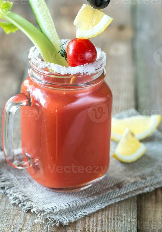 Tomato juice in the mason jar photo