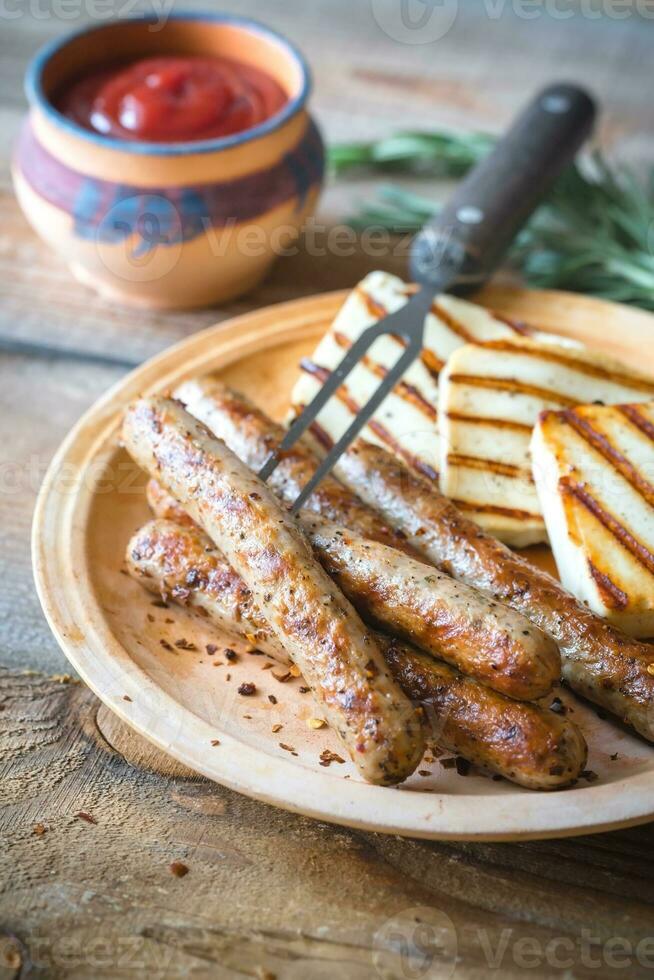 Grilled sausages and cheese with rosemary photo