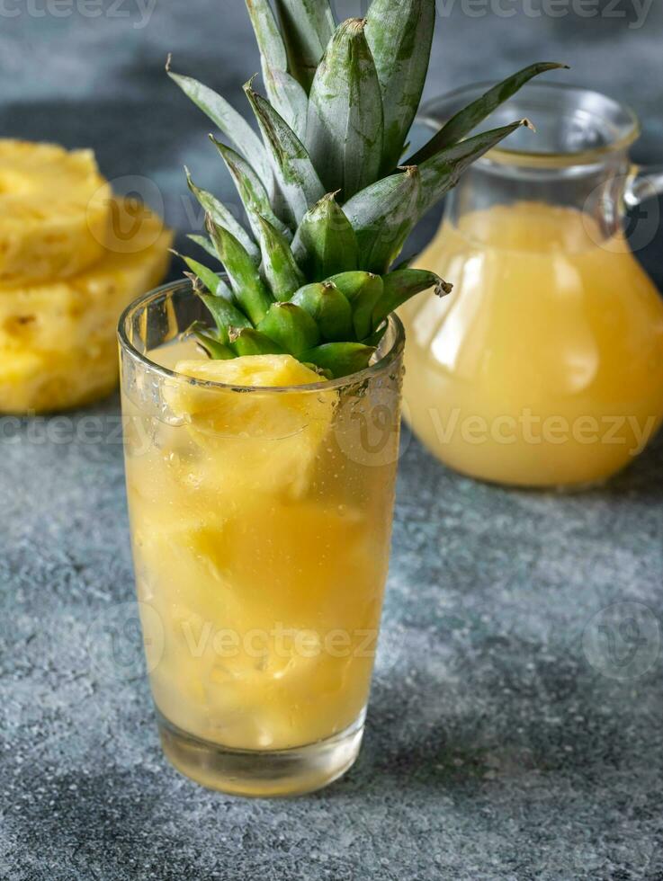 Glass of pineapple juice photo