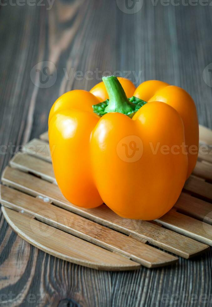 Bell pepper on the wooden board photo