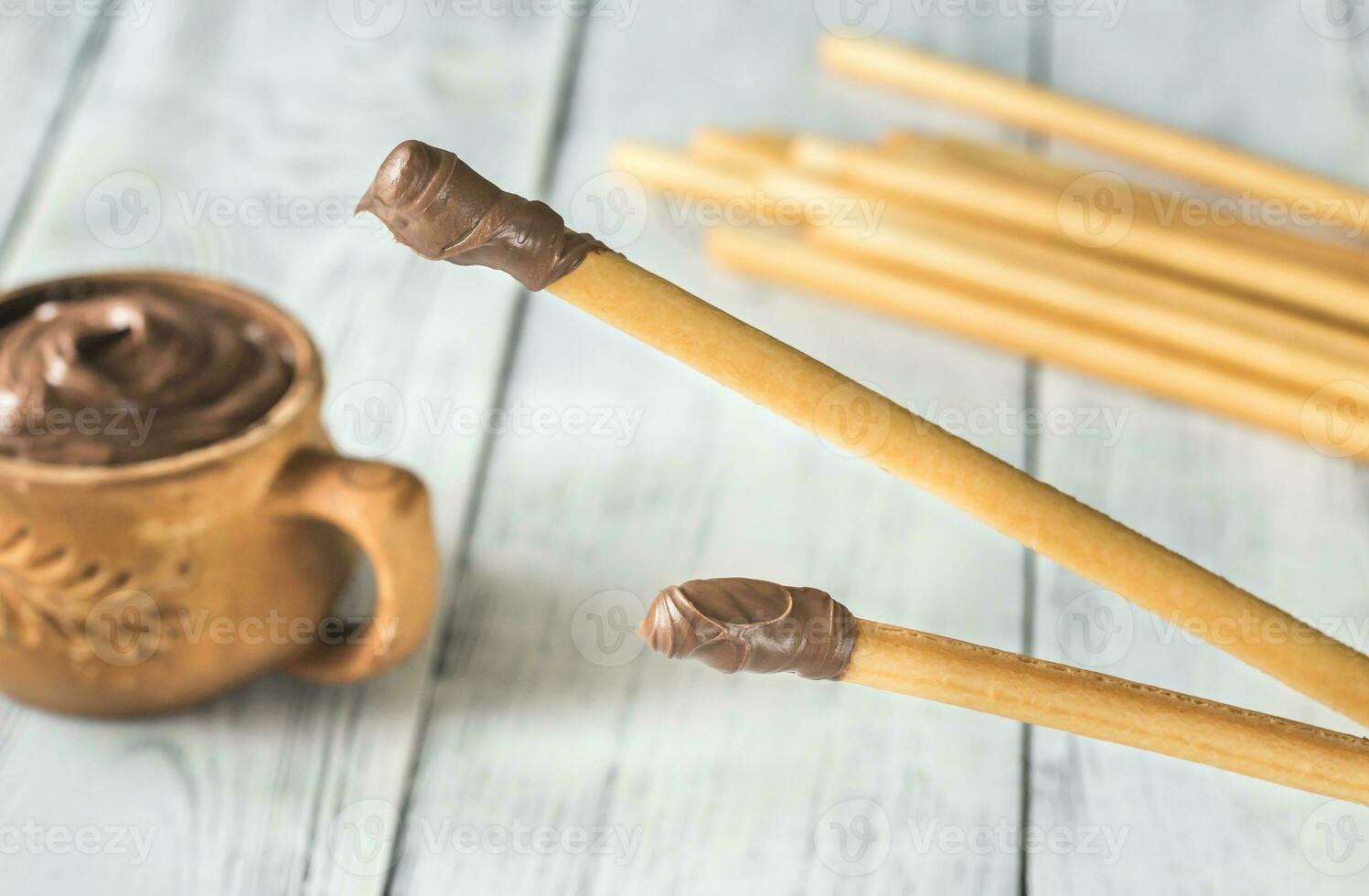 Breadsticks with chocolate cream photo