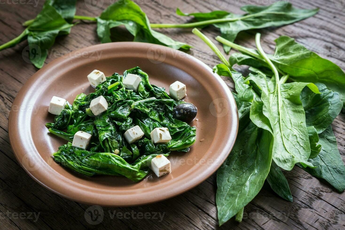 Spinach with cheese, olives photo