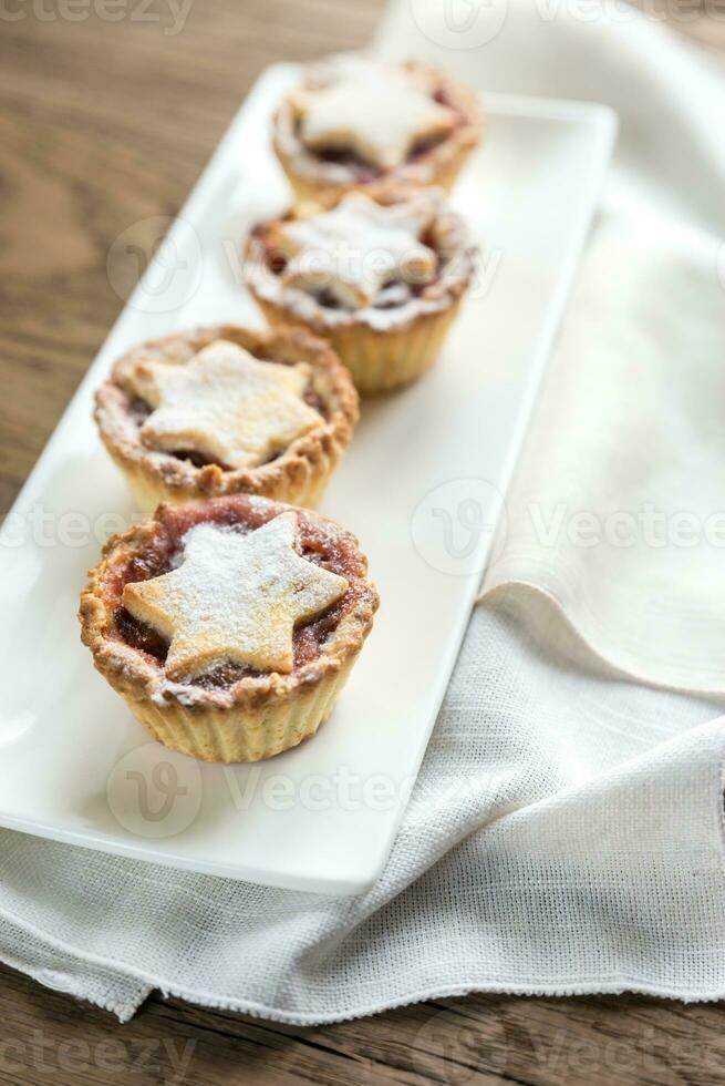 Mince pies with Christmas tree branch photo