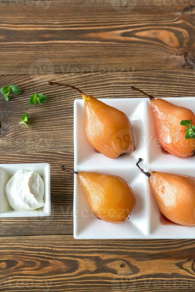 Poached pears on the plate photo