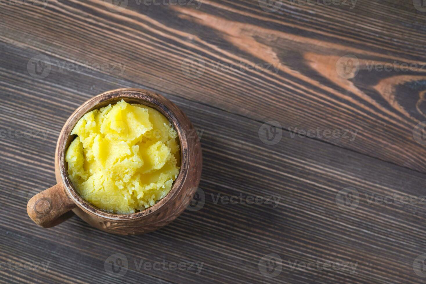 Bowl of ghee clarified butter photo