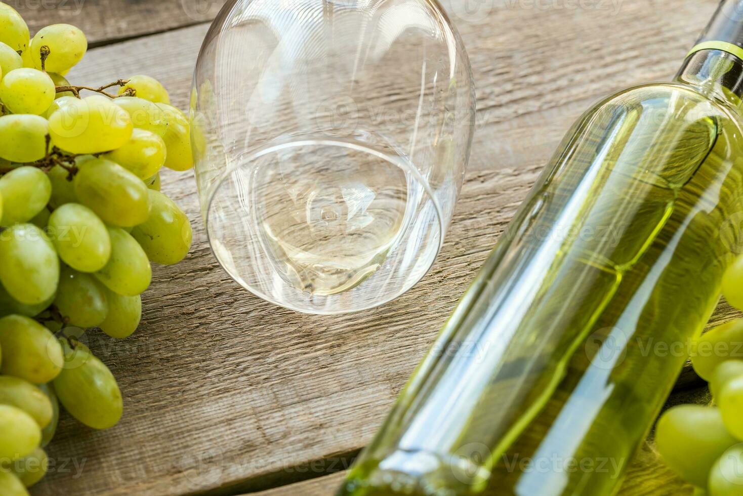 White wine with bunch of grape photo