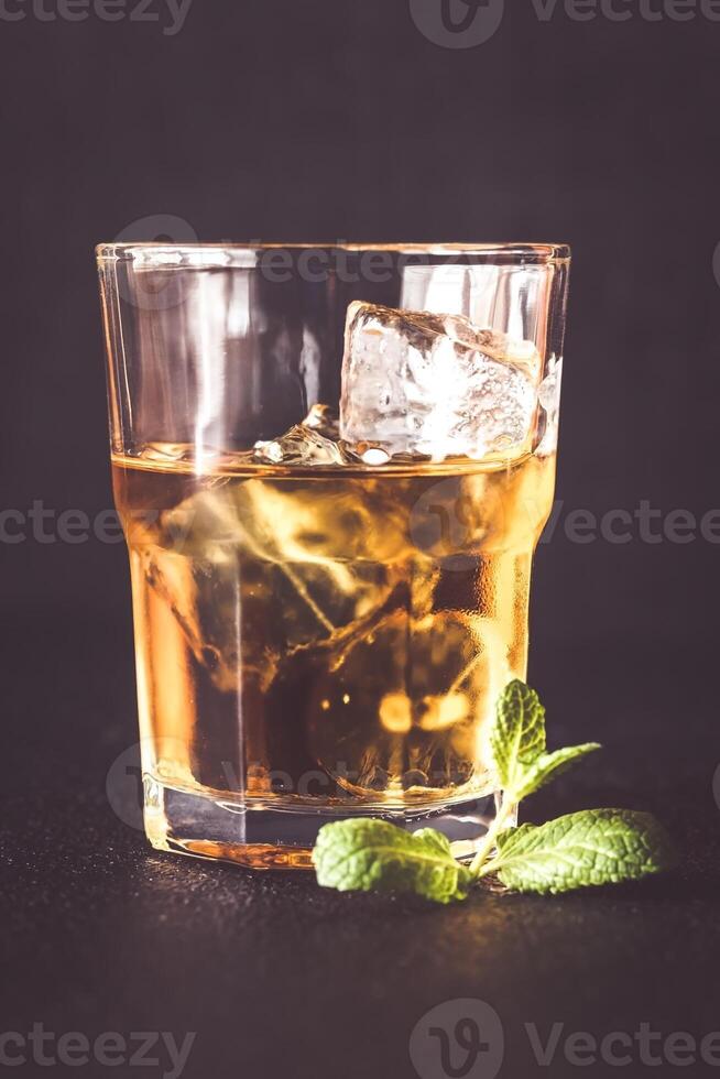 Glass of rum on the dark background 24217283 Stock Photo at Vecteezy