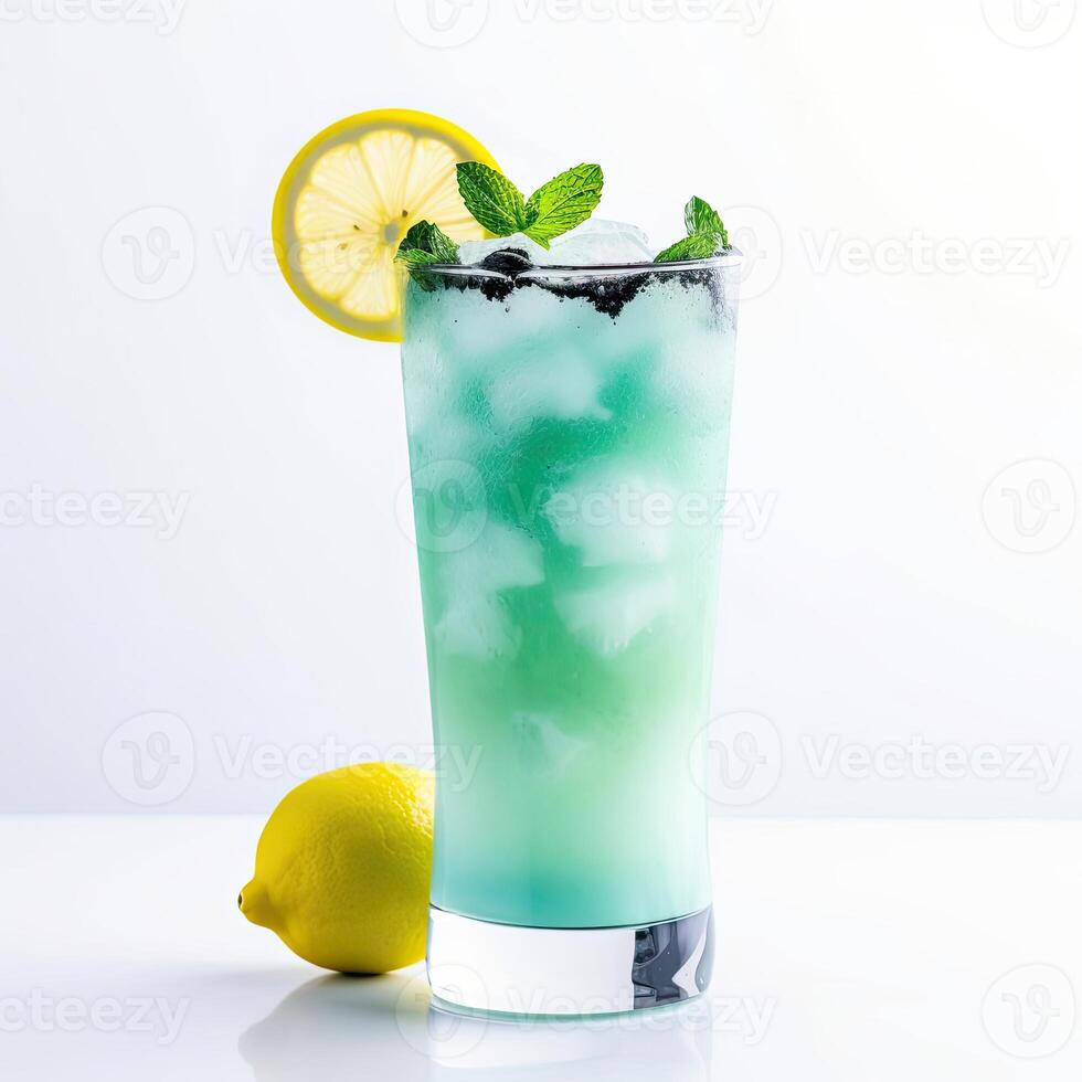 Blue matcha lemonade. Composition of cocktail and lemon on a white background. Design for invitations, postcards, business cards. photo