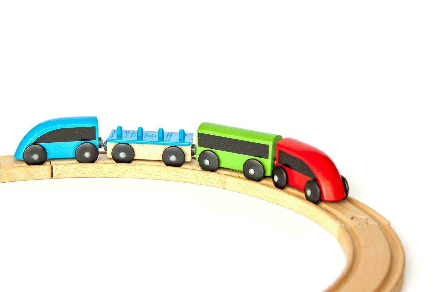 Children's railway made of wood on a white background. photo