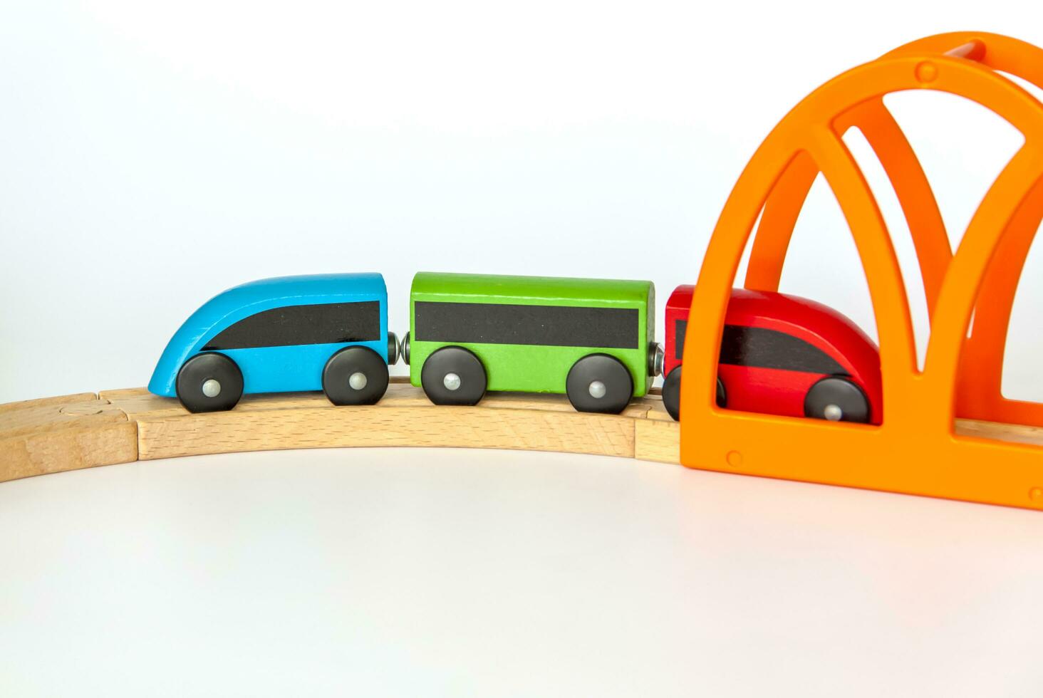 Children's railway made of wood on a white background. photo
